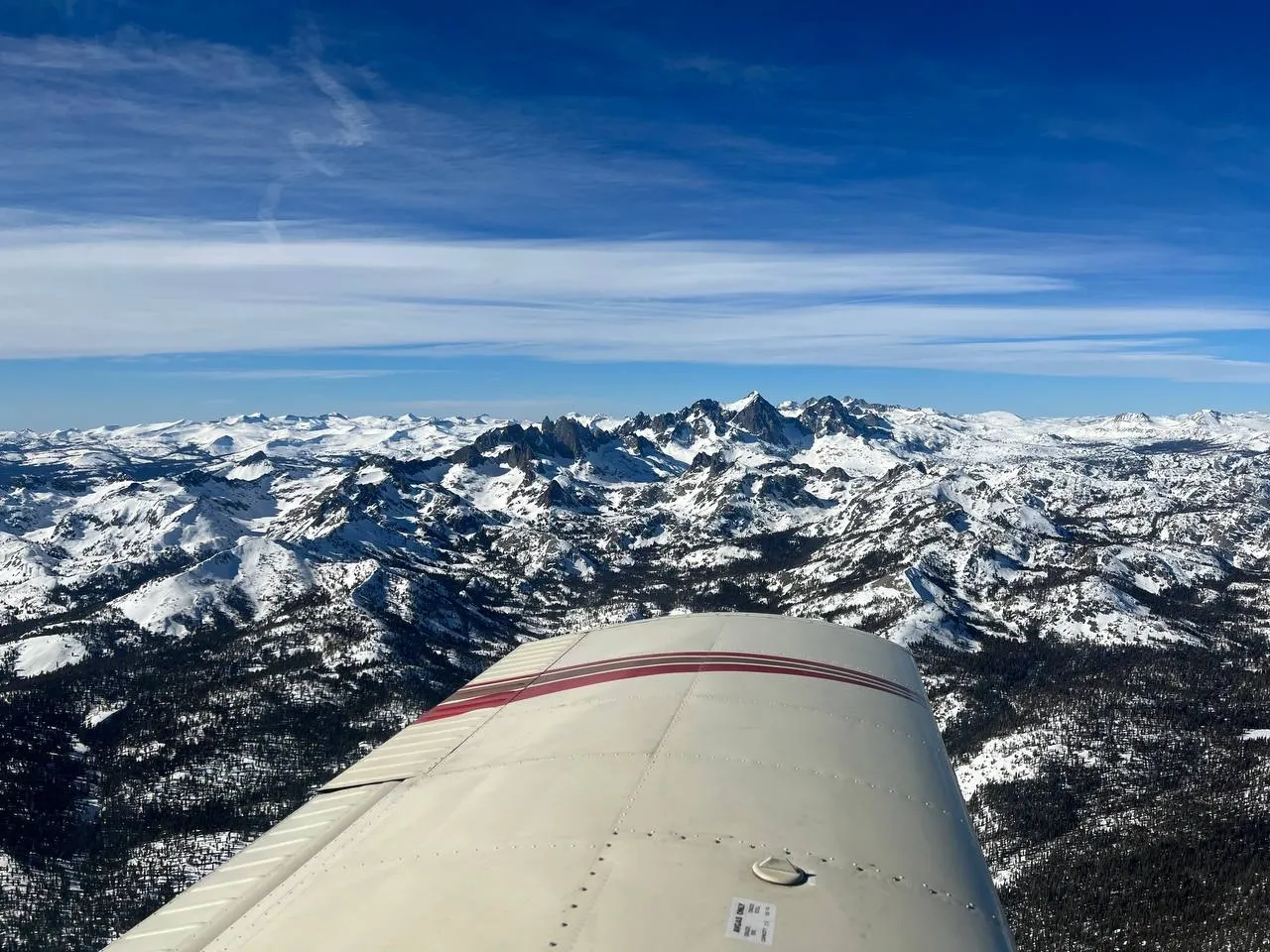 NV Flight School aircraft over the Sierra Nevada at sunset