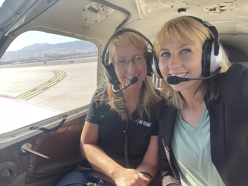 Pilot and instructor in cockpit of small plane